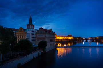 PRAGUE, CZECH REPUBLIC - July 25, 2017 : Old Town ancient architecture and river pier in Prague, Czech Republic