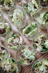 Fresh salad sets in glasses