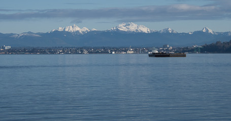 2019-12-29 THE MUKLITO SHORELINE WITH SNOW CAPPED MOUNTAINS