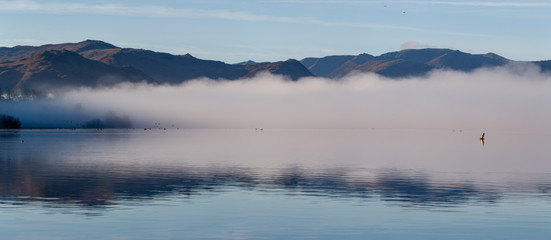 Obraz na płótnie Canvas misty lake in cumbria england uk 