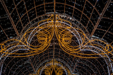Christmas night neon glowing cityscape. Buildings with decorations and lamps. Minsk Belarus. December 31 2019
