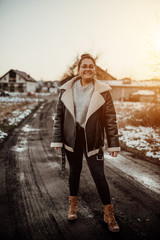 Fototapeta premium Portrait of afro woman in glasses on nature. Smile, positive, smart.