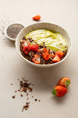 Healthy smoothie bowl with granola and chia seeds, food close-up