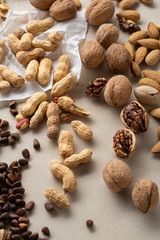 Assorted fresh and organic nuts close-up, walnut and peanut