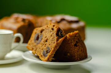 Sliced delicious spiced fruit cake served on a ceramic plate