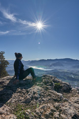 woman loving nature and sun in the mountain