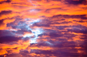 Fototapeta premium A very extraordinary and beautiful sunset in orange and purple colours, lightened and bright
