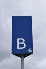 Blue Metal Parking Sign with White Lettering  & Large Letter B 
