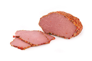 Beef ham in herbs. Traditional sausage products white white background.