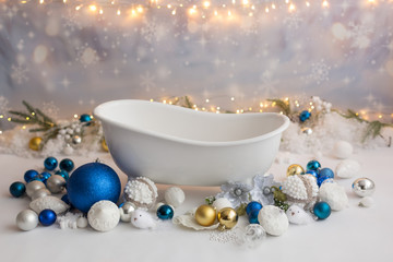 background texture. children's bath with Christmas toys balls. Christmas decor in a milk bath