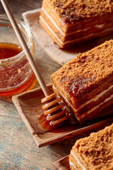 Homemade layered honey cake with cream.