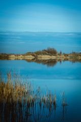 Lake with horizon and reflections