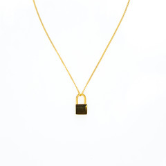 Gold lock necklace on white background