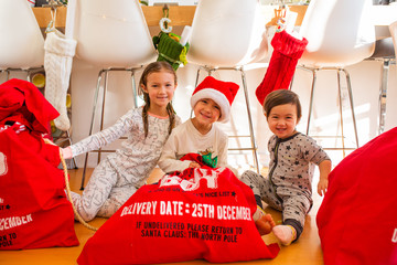 Children Opening Presents on Christmas Morning