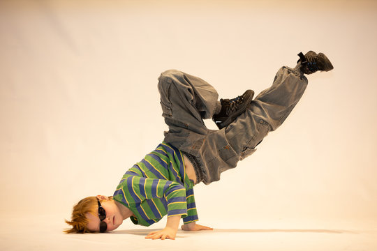 young dancer in breakdance position, child in a unique dance pose