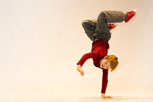 young dancer in breakdance position, child in a unique dance pose