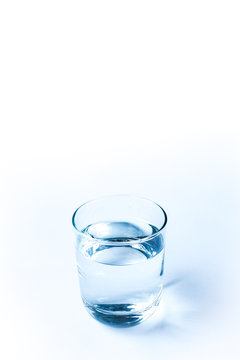 simple glass of water on blank white space