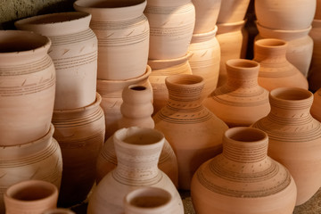 Fototapeta na wymiar Various amphorae and vases made of terracotta in a pottery