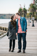 Couple stop for a kiss while walking the boardwalk in Georgetown, Washington DC - 312688561