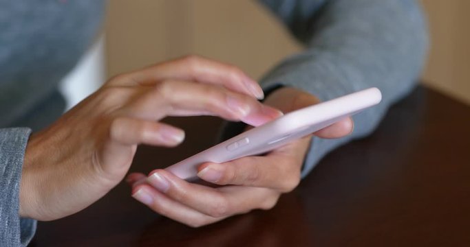 Woman use of mobile phone for online searching