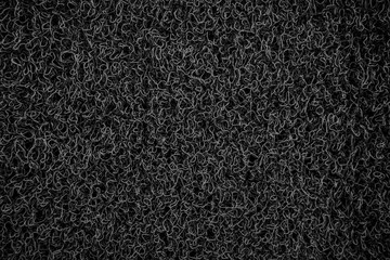 Background of black coil car floor mat  texture