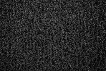 Background of black coil car floor mat texture	