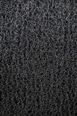 Fototapeta premium Background of black coil car floor mat texture