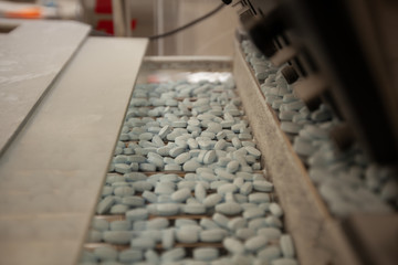 Pills on pharmaceutical production line