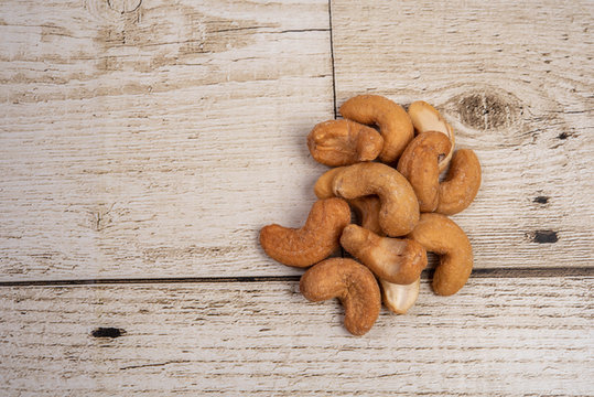 Anacardium occidentale. Dried fruit. Export food. Asia on the wood floor.