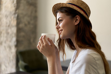 portrait of young woman with cup of coffee