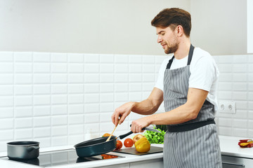 woman cutting vegetables in kitchen
