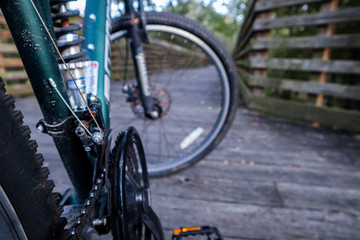 Fototapeta premium Mountain Bike on Swampy Wooden Bridge