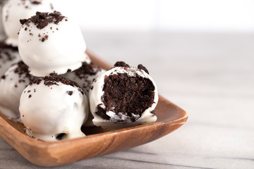 A Pile of White Chocolate Covered Chocolate Sandwich Cookie Truffles