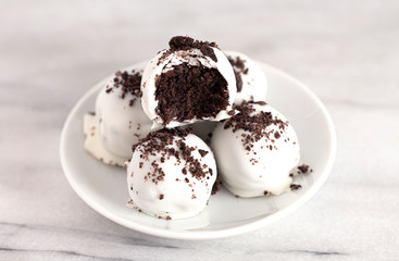 A Pile of White Chocolate Covered Chocolate Sandwich Cookie Truffles