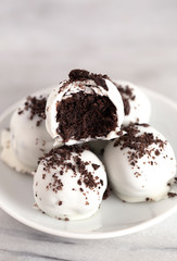 A Pile of White Chocolate Covered Chocolate Sandwich Cookie Truffles