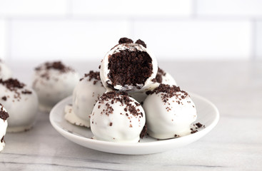 A Pile of White Chocolate Covered Chocolate Sandwich Cookie Truffles