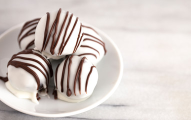 A Pile of White Chocolate Covered Chocolate Sandwich Cookie Truffles