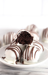 A Pile of White Chocolate Covered Chocolate Sandwich Cookie Truffles