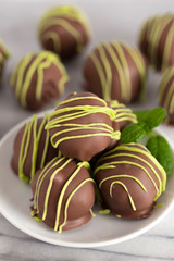 Pile of Chocolate Covered Green Striped Mint Truffles