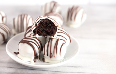 A Pile of White Chocolate Covered Chocolate Sandwich Cookie Truffles