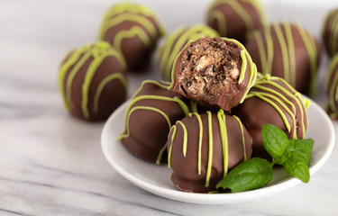 Pile of Chocolate Covered Green Striped Mint Truffles
