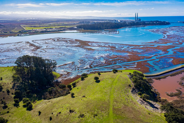 Aerial Panoramic View of Elkhorn Slough, Moss Landing, California. Elkhorn Slough is a 7-mile-long tidal slough and estuary on Monterey Bay in Monterey County, California.  - obrazy, fototapety, plakaty