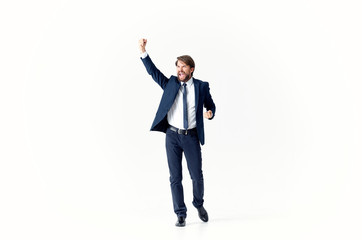 happy young businessman with his arms up