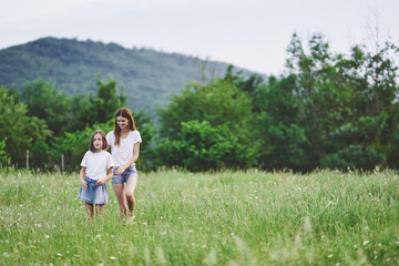 Obraz premium mother and daughter on the meadow
