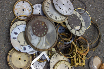 Pile of old clock faces