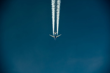 aerial view of a jet creating a contrail