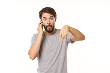 young man talking on the phone isolated on white