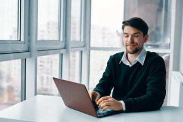 Fototapeta premium businessman working on laptop in office