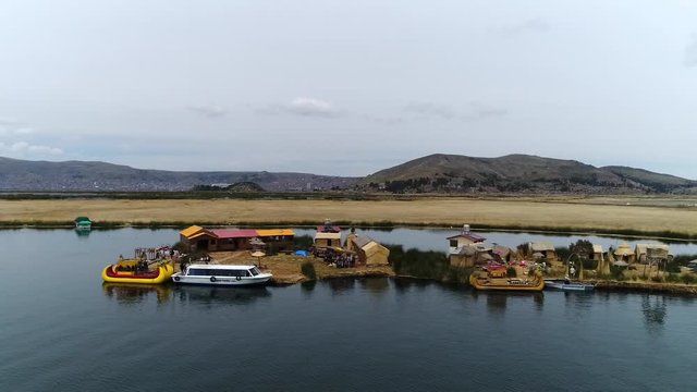 Right travelling movement of drone. Uros Floating Islands over Titicaca lake, Peru