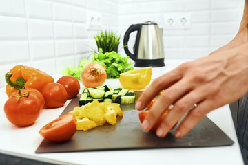 woman cutting vegetables in the kitchen